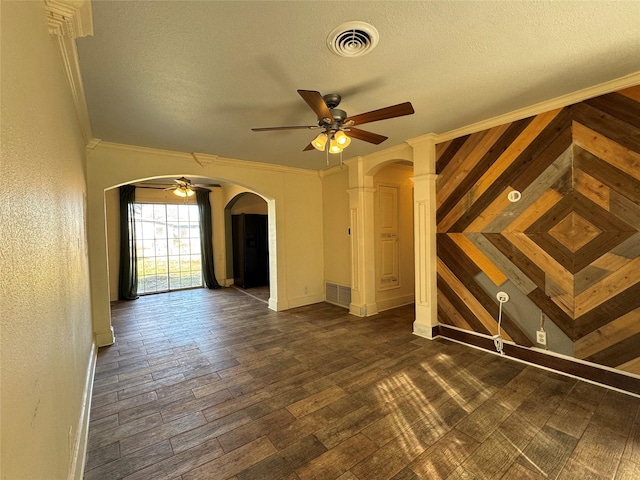 unfurnished room with ornamental molding, ceiling fan, a textured ceiling, and dark hardwood / wood-style flooring