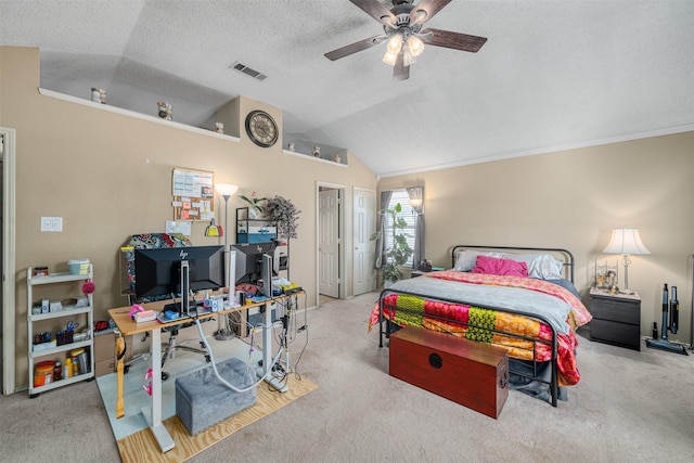 carpeted bedroom with ceiling fan, ornamental molding, vaulted ceiling, and a textured ceiling