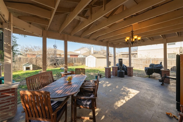 view of patio with a gazebo and a shed