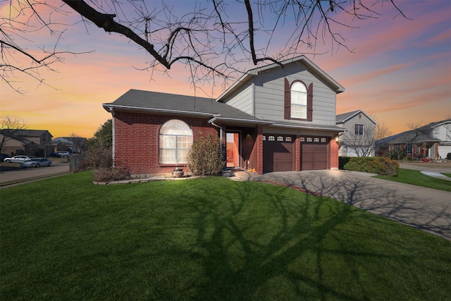 front facade with a garage and a yard