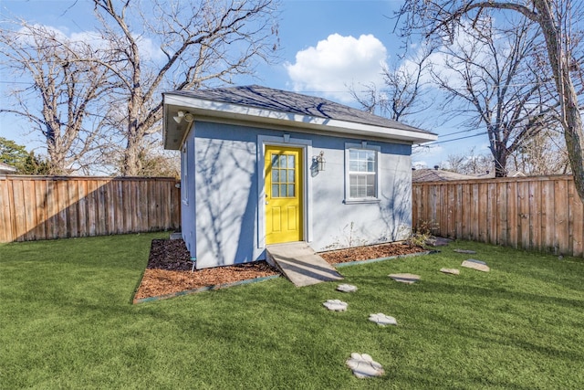 view of outbuilding featuring an outdoor structure and a fenced backyard