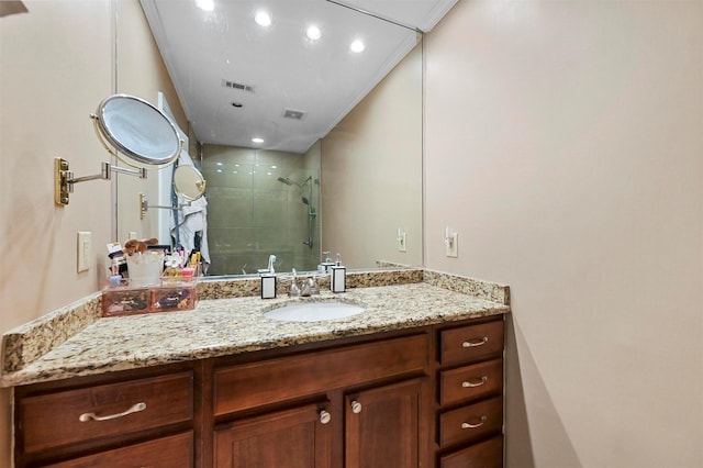 bathroom featuring vanity and an enclosed shower