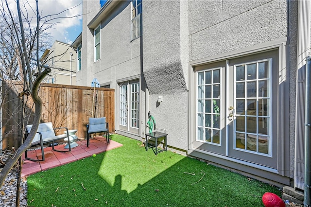 view of yard with a patio area and french doors