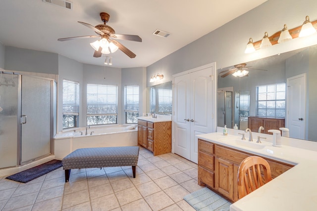 bathroom featuring tile patterned floors, separate shower and tub, and a wealth of natural light