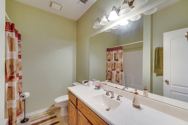 bathroom with tile patterned floors, vanity, toilet, and curtained shower