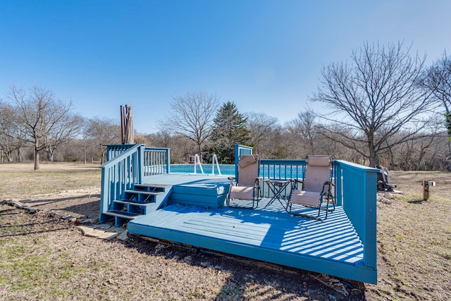 wooden terrace with a swimming pool