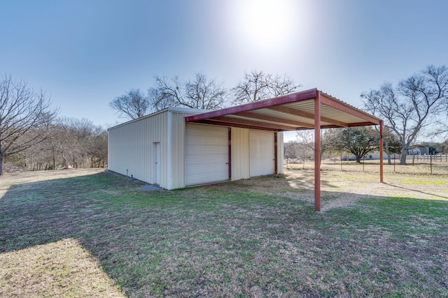 view of outbuilding with a lawn