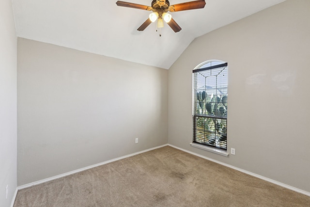 unfurnished room with lofted ceiling, light colored carpet, and ceiling fan