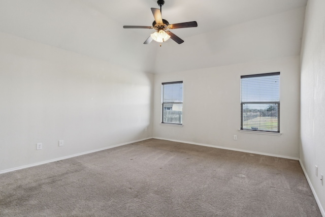 carpeted empty room featuring lofted ceiling and ceiling fan