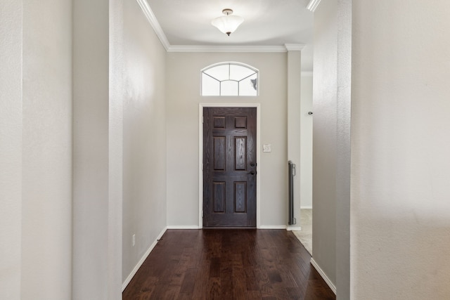 foyer featuring dark wood-type flooring and ornamental molding