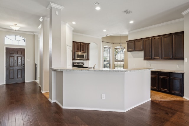 kitchen with crown molding, stainless steel appliances, dark hardwood / wood-style flooring, and decorative light fixtures