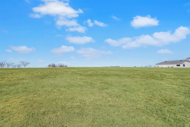 view of yard with a rural view