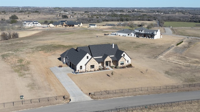 birds eye view of property featuring a rural view