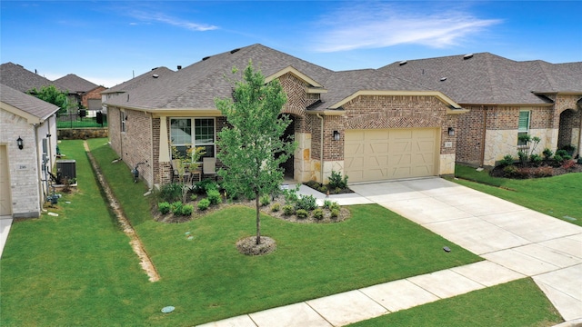 ranch-style house featuring a garage, central air condition unit, and a front lawn