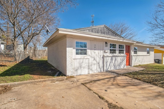 view of front facade featuring a garage and an outdoor structure