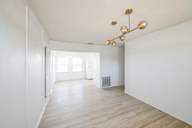 unfurnished room featuring light hardwood / wood-style flooring