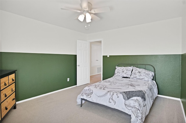 bedroom with ceiling fan and carpet flooring