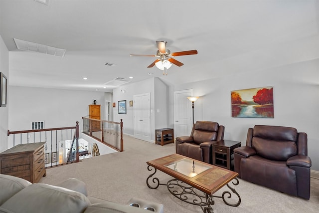 living room with ceiling fan and light carpet