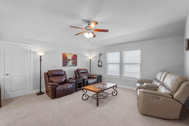 living room with ceiling fan and carpet flooring