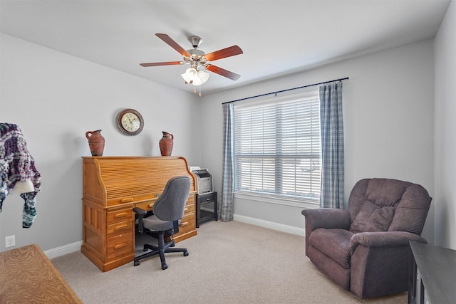 carpeted office featuring ceiling fan