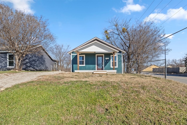 view of front of property featuring a front yard and a porch