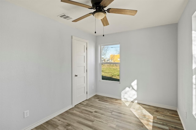 unfurnished room featuring ceiling fan and light wood-type flooring