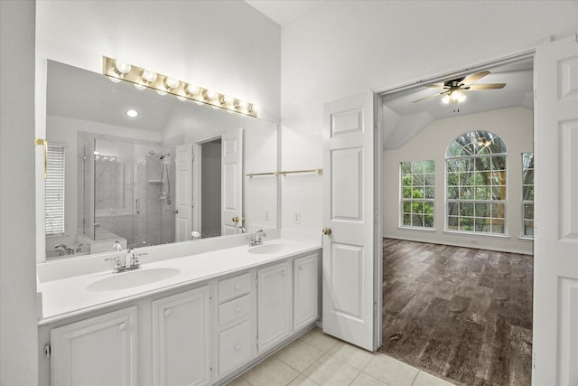 1527 Murphy Dr, Rockwall, TX 75087 - bathroom featuring a stall shower, vanity, a garden tub, lofted ceiling, and tile patterned flooring