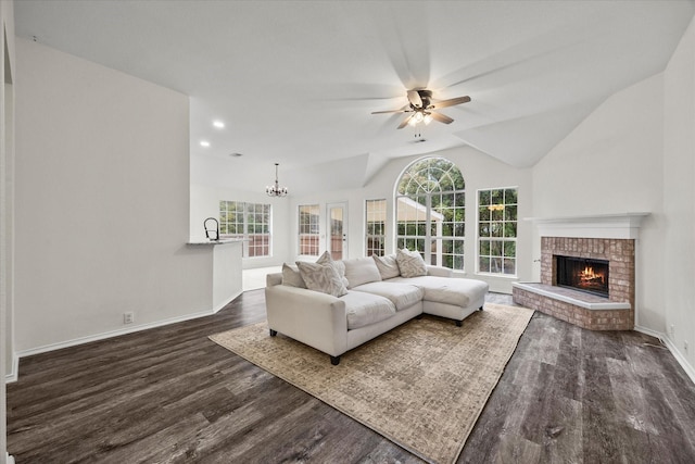1527 Murphy Dr, Rockwall, TX 75087 - dining space with dark wood finished floors, a lit fireplace, crown molding, a raised ceiling, and a chandelier