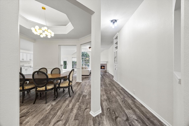 1527 Murphy Dr, Rockwall, TX 75087 - living area featuring dark wood-type flooring, ceiling fan, a fireplace, and baseboards
