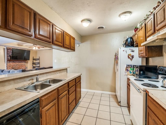 kitchen featuring sink, light tile patterned floors, black dishwasher, white range with electric stovetop, and a textured ceiling