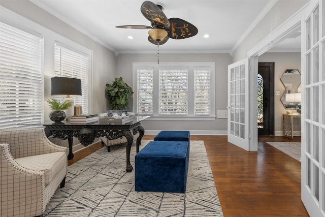 living area featuring wood-type flooring, ornamental molding, french doors, and ceiling fan