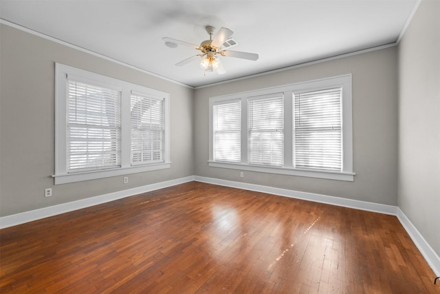 spare room with ceiling fan, ornamental molding, and dark hardwood / wood-style floors