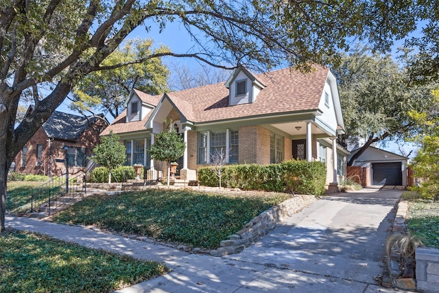 view of front of property featuring an outbuilding and a garage