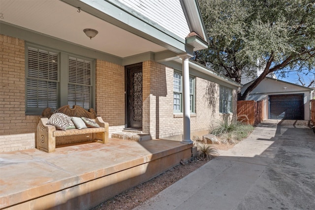 view of patio / terrace featuring a garage and an outdoor structure