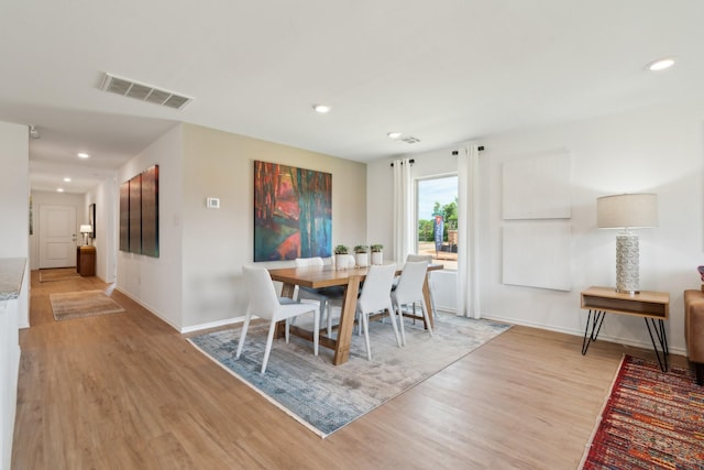 dining room featuring light hardwood / wood-style flooring