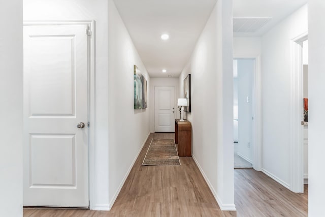 corridor featuring light hardwood / wood-style flooring