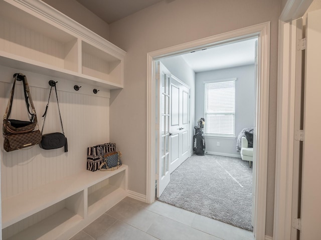 mudroom featuring carpet flooring