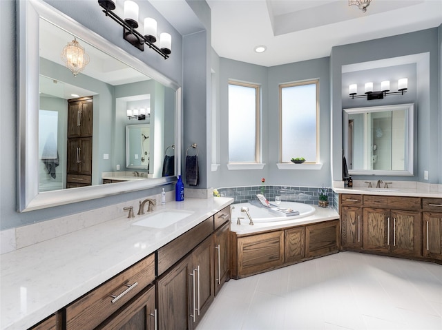 bathroom featuring vanity and a washtub