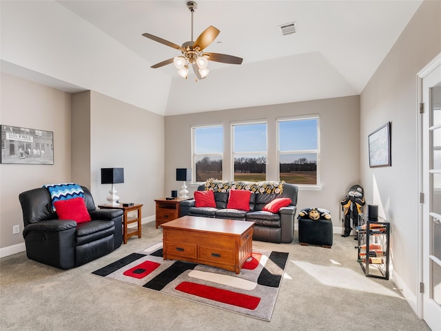 carpeted living room with ceiling fan and lofted ceiling