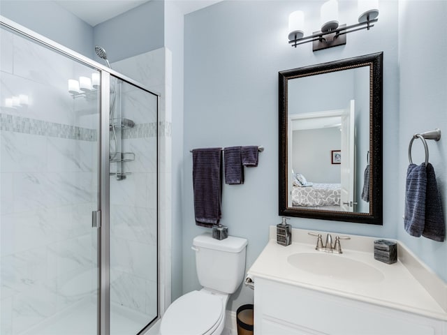 bathroom featuring walk in shower, vanity, and toilet