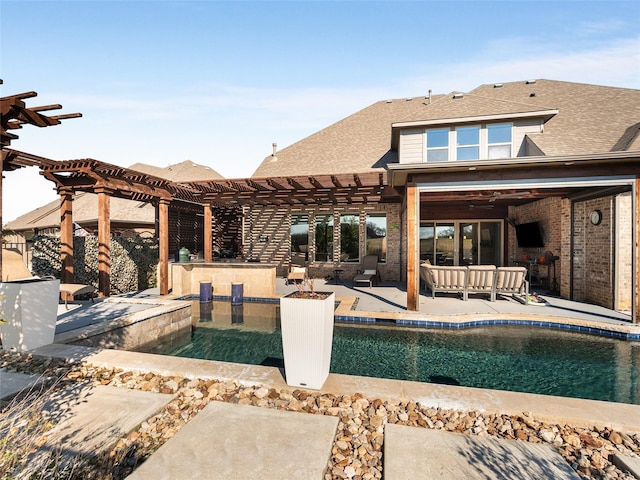 view of swimming pool with a bar, an outdoor hangout area, a pergola, and a patio