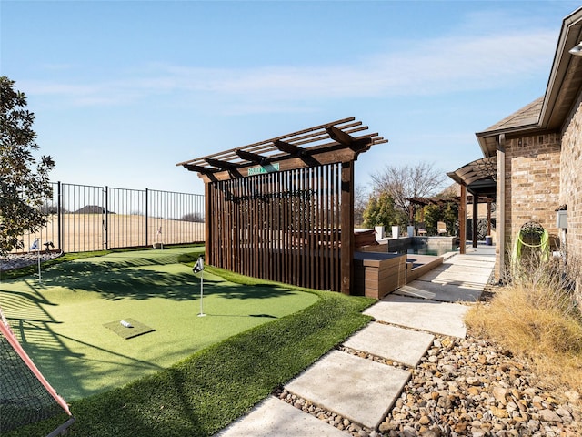 view of yard with a fenced in pool and a pergola