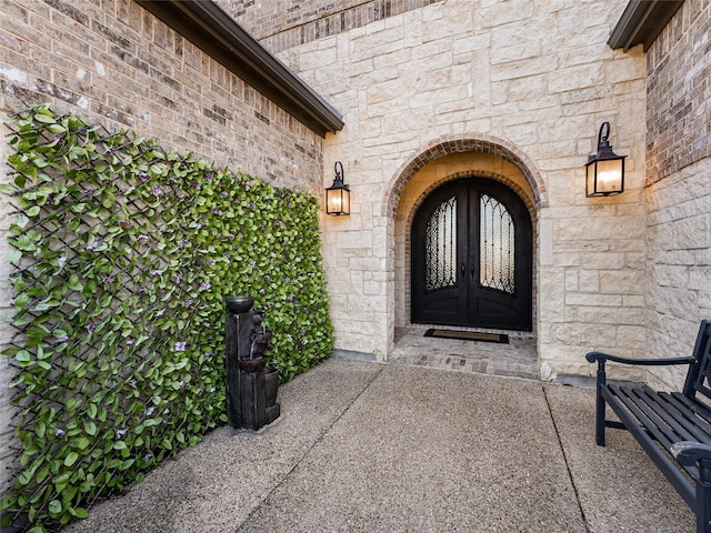 property entrance featuring french doors