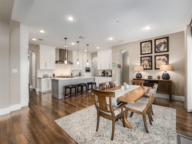 dining space featuring dark hardwood / wood-style flooring