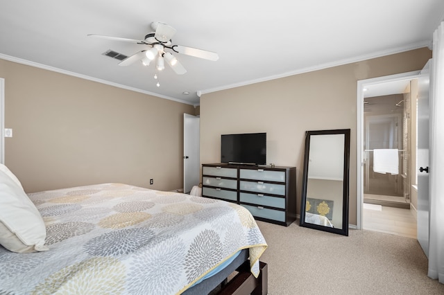 carpeted bedroom with connected bathroom, ornamental molding, and ceiling fan