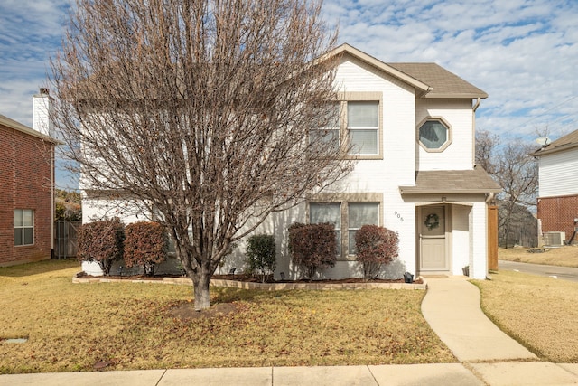 view of front property featuring central AC and a front lawn