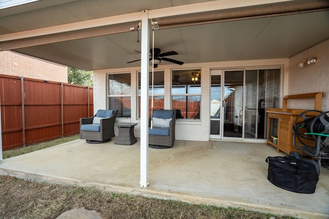 view of patio featuring ceiling fan