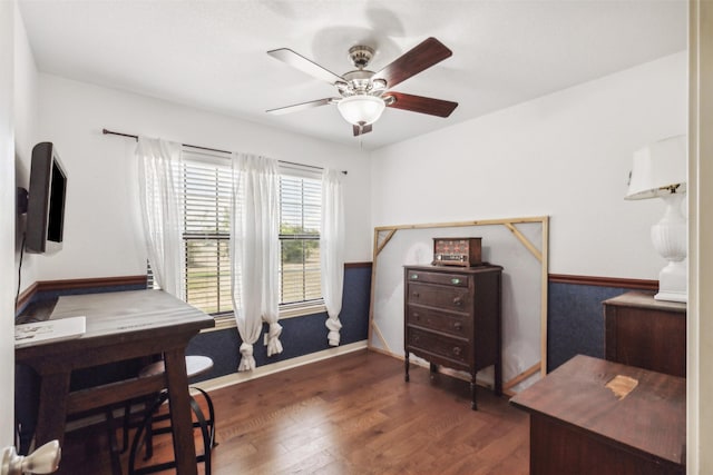 home office with dark hardwood / wood-style floors and ceiling fan