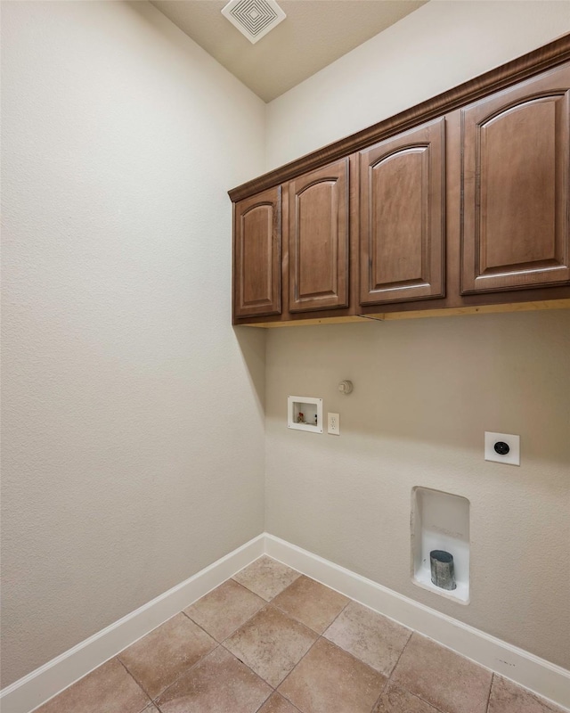 clothes washing area with gas dryer hookup, hookup for a washing machine, cabinets, and hookup for an electric dryer