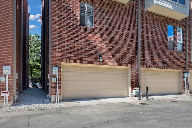 view of side of home with a garage